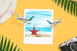Paper photo of the beach on desk which the planes come out concept. Summer vacation top view, flat lay composition
