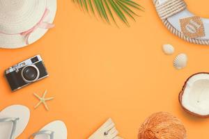 Flat lay traveler accessories on orange background with copy space in the middle. Top view, flat lay travel composition photo