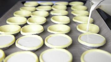 Chef preparing homemade eggs tart before putting into the oven