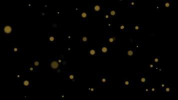 Soft focus small golden bokeh over black background - computer motion graphic background concept video