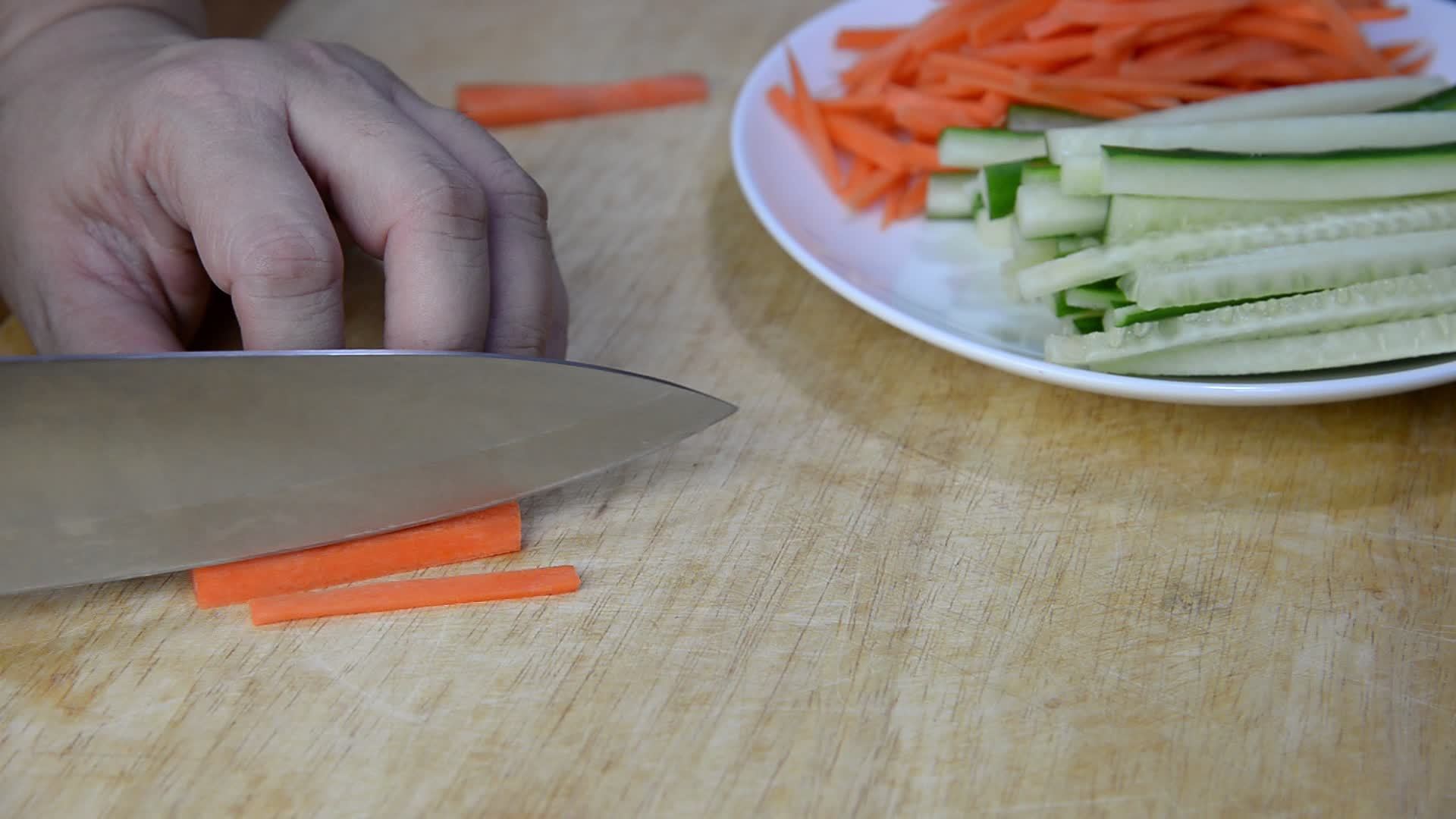 Chef cutting carrot vegetable for making sushi people with favorite dish Japanese food concept