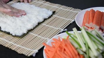 Chef preparing sushi roll - people with favorite dish Japanese food concept video