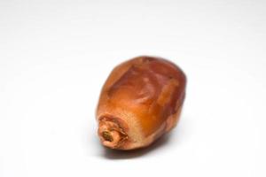 One Piece of Dates with White Background. photo