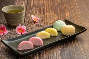 Daifukumochi, or Daifuku, is a Japanese confection consisting of a small round mochi stuffed with sweet filling, Japanese traditional sweets. photo