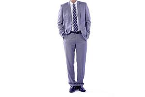 Businessman wearing an elegant suit over white background. Well-dressed senior man in the studio That emphasizes thoughtful thinking, thinking carefully. photo