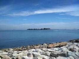 beautiful beach with coral at summertime, centre point makassar, south sulawesi, indonesia photo