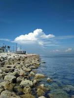 beautiful beach with coral at summertime, centre point makassar, south sulawesi, indonesia photo