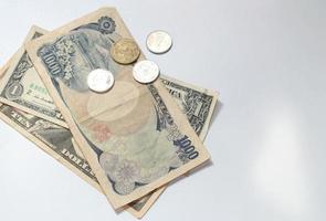 Yen, dollar, baht money on white background photo