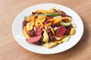 Mixed healthy vegetable chips with okra, carrots, pumpkin, beetroot and shiitake mushrooms. photo