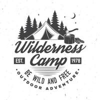 Wilderness camp. Be wild and free. Vector illustration. Concept for badge, shirt or logo, print, stamp. Vintage typography design with campin tent, axe and forest silhouette.