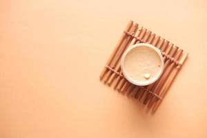 top view of peanut butter in a container , photo