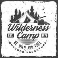 Wilderness camp. Be wild and free. Vector illustration. Concept for badge, shirt or logo, print, stamp. Vintage typography design with campin tent, axe and forest silhouette.