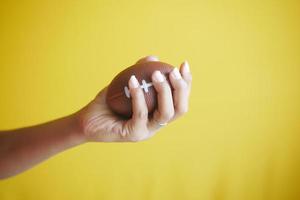 Hand and Finger Strengthening Exercises on yellow background photo