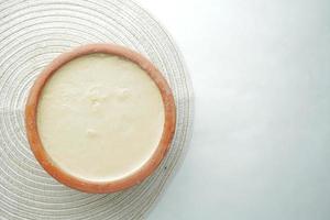 fresh yogurt in a bowl on table photo