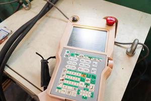 remote control for robotic arm machine to work in the factory. photo