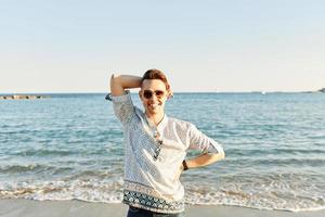 Portrait of an attractive man on the beach photo