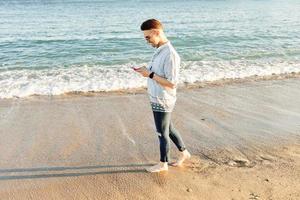 A man walking on the beach photo