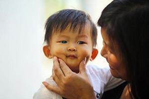 Portrait of asian baby with mother. Woman lifestyle mother's day concept. photo