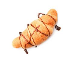 Tasty croissant with chocolate on white background photo