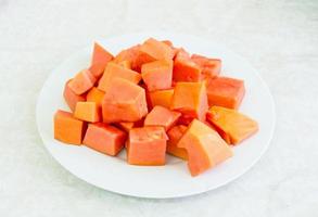 Papaya on white plate photo