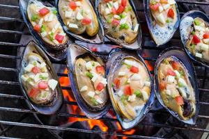 Grilled mussels on flames photo