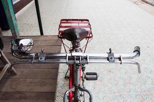 Detail of a red vintage bicycle photo