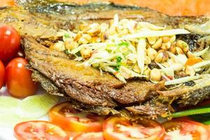 fried fish isolated in white background photo