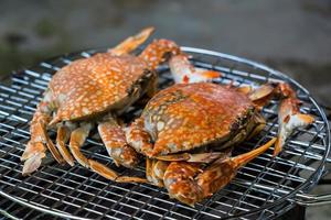 crabs shrimps on charcoal grill photo