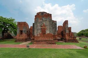 old ruins temple in green grass field photo