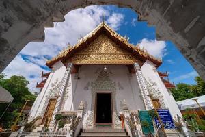 white marble public ancient temple inside arch entrance Wat Phra That Cho Hae, the royal sacred ancient temple photo