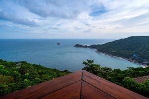 wooden table with sea view photo