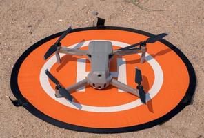 drone landing on landing pad photo