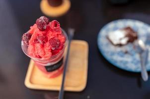 selective focus closeup frozen raspberry frappe on table photo