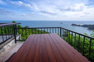 woooden table on sea view terrace photo