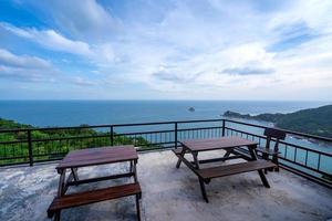 tables on sea view rooftop photo