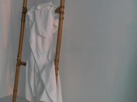 white towel on wooden ladder photo