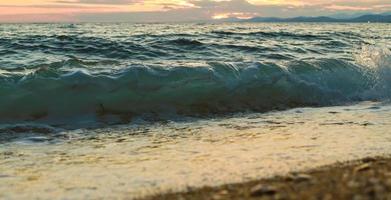 Sea wawes on beach in Greece photo