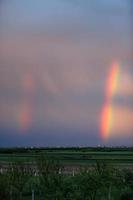 Rainbow above village in Serbia photo