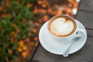 latte art coffee with heart shape photo