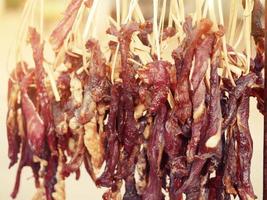 The dried beef is laid out in a row to spread. photo