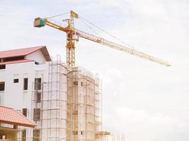 The building under construction overlooking the sky and clouds. photo