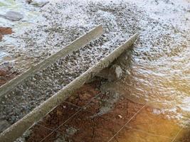 Pour the finished cement in a medium area. photo