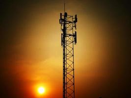 Telephone towers used to broadcast signals at dusk. photo