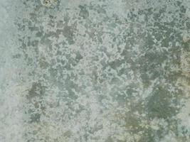 colored cement cracked concrete surface, texture of rough photo