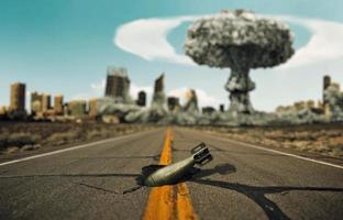 Bomb on the road. Background a nuclear explosion. photo