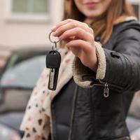 Young girl holding car keys in her hand photo