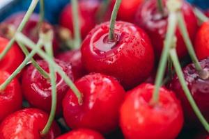 Bright juicy red cherry in drops of water. photo