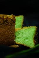 Pandan flavored chiffon bread with black background photo