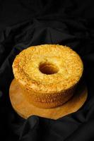 Cheese chiffon cake on black background photo