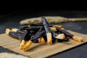 Chocolate cookie sticks on a white background. photo